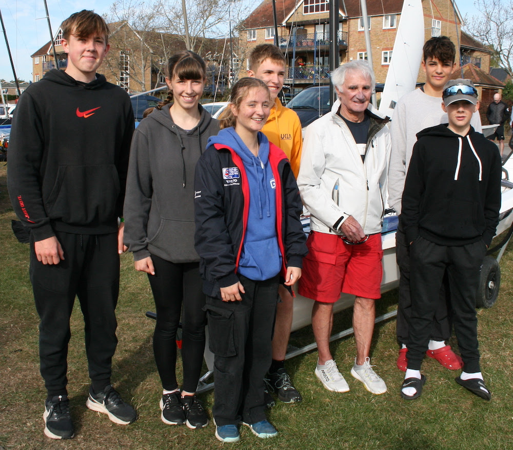 Young members of the Endeavour fleet enjoy a chat with Keith Musto (Olympic silver medalist and winner of the first ever Endeavour Trophy which took place in 1961 when he was crewing for Peter Bateman representing the International Cadet class). From Left: Sam Grayton, Jessica Powell, Tatiana Hazelwood, Leo Yates, Keith Musto, Joe Jones and Dylan Creighton – photo Sue Pelling